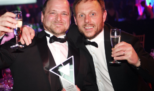 Paul Anderson and Rob Gray holding an award